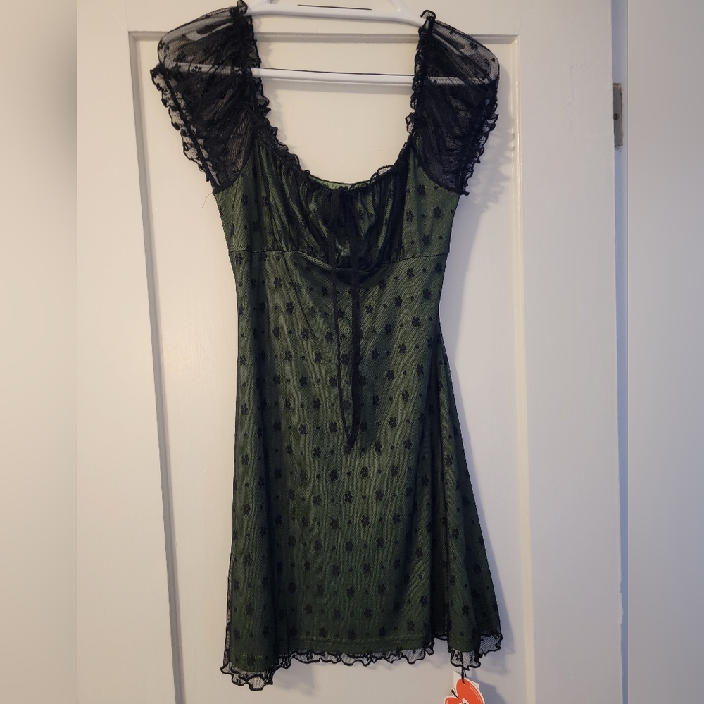 Green with black lace mini dress from Cider. NWT size M.